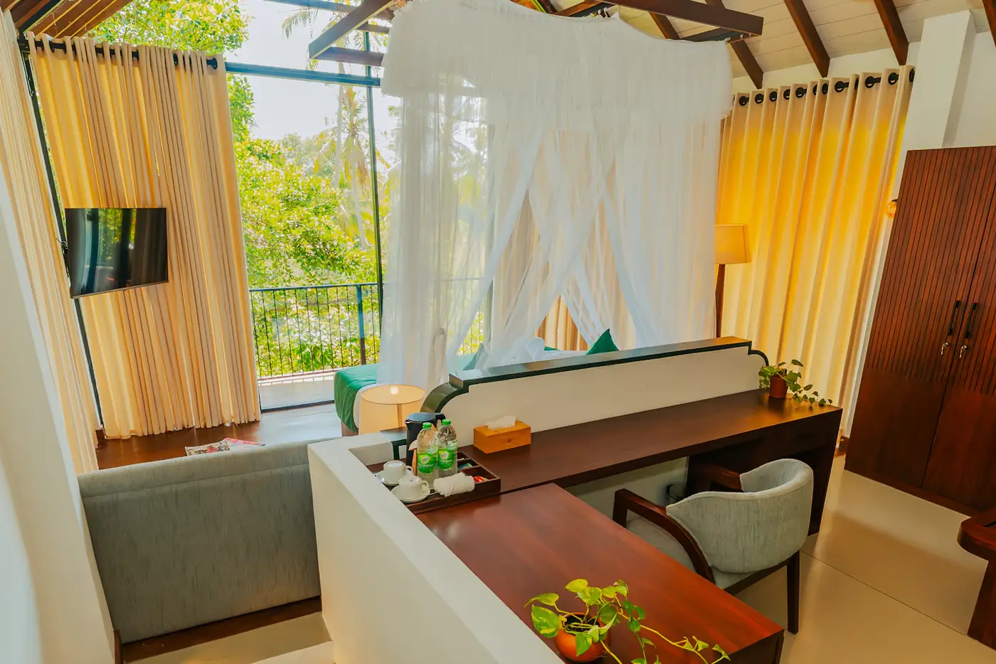 Canopy bed with white netting and garden view