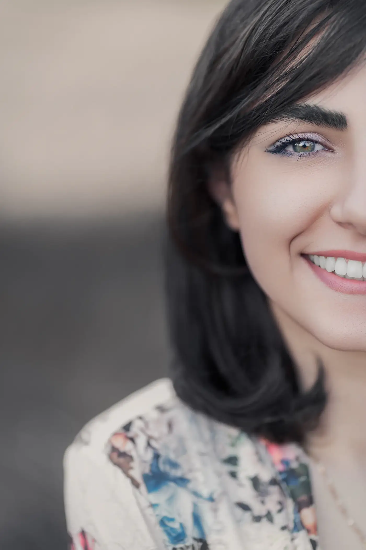 Close portrait of a smiling woman with blue eyes