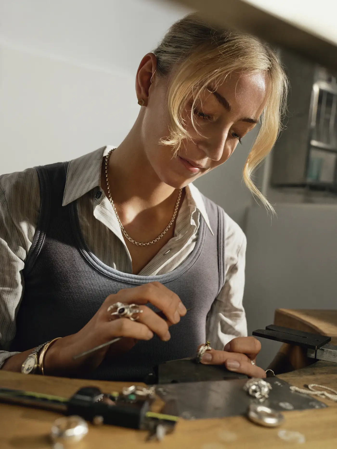 Jeweller at the bench shaping a ring