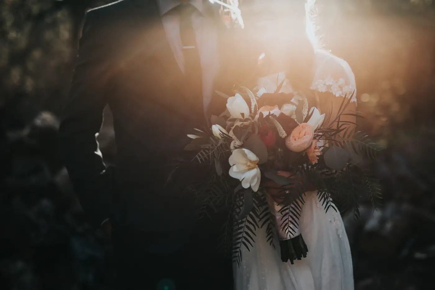 Bride holding a bouquet in warm light