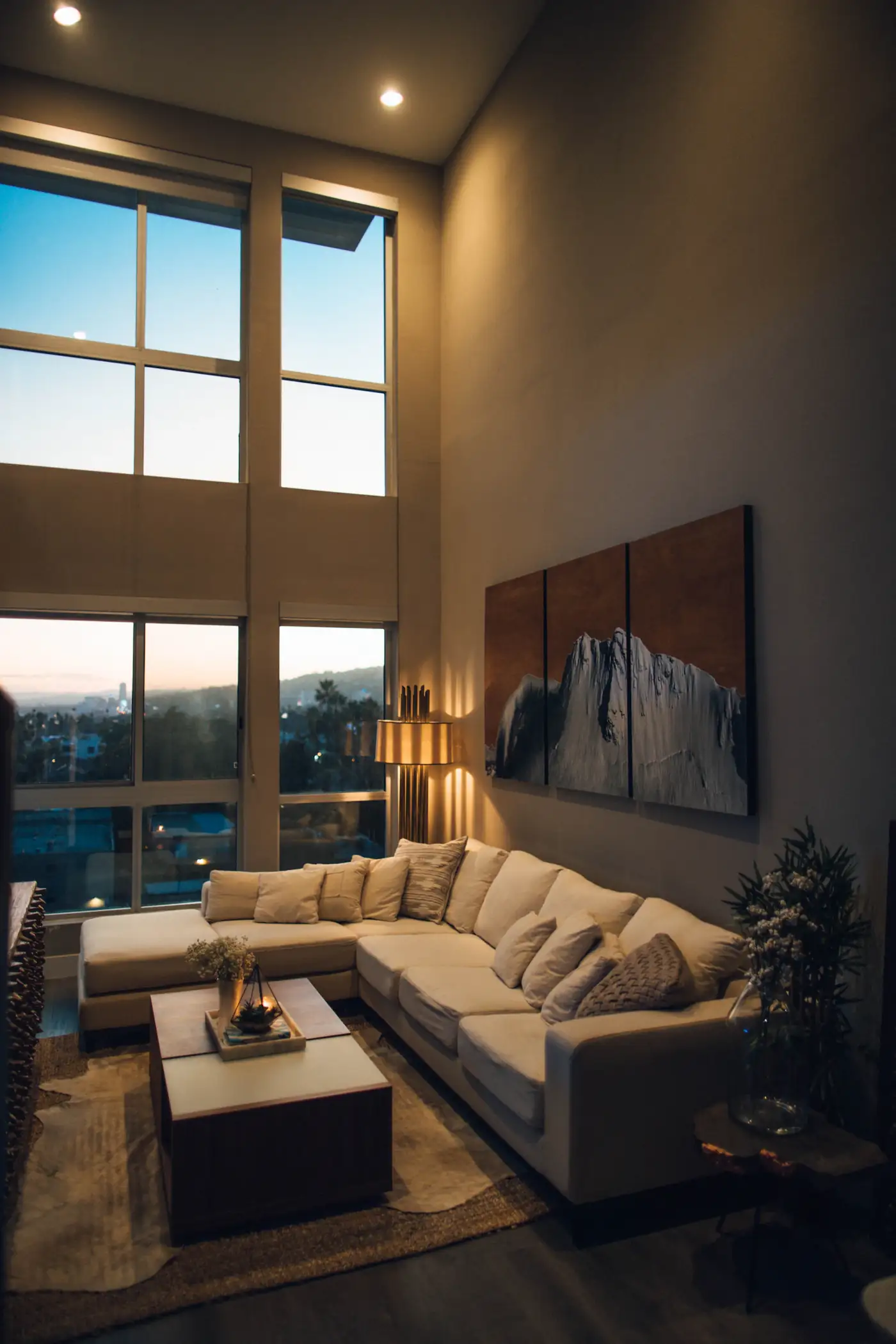 Double height living room with sunset windows