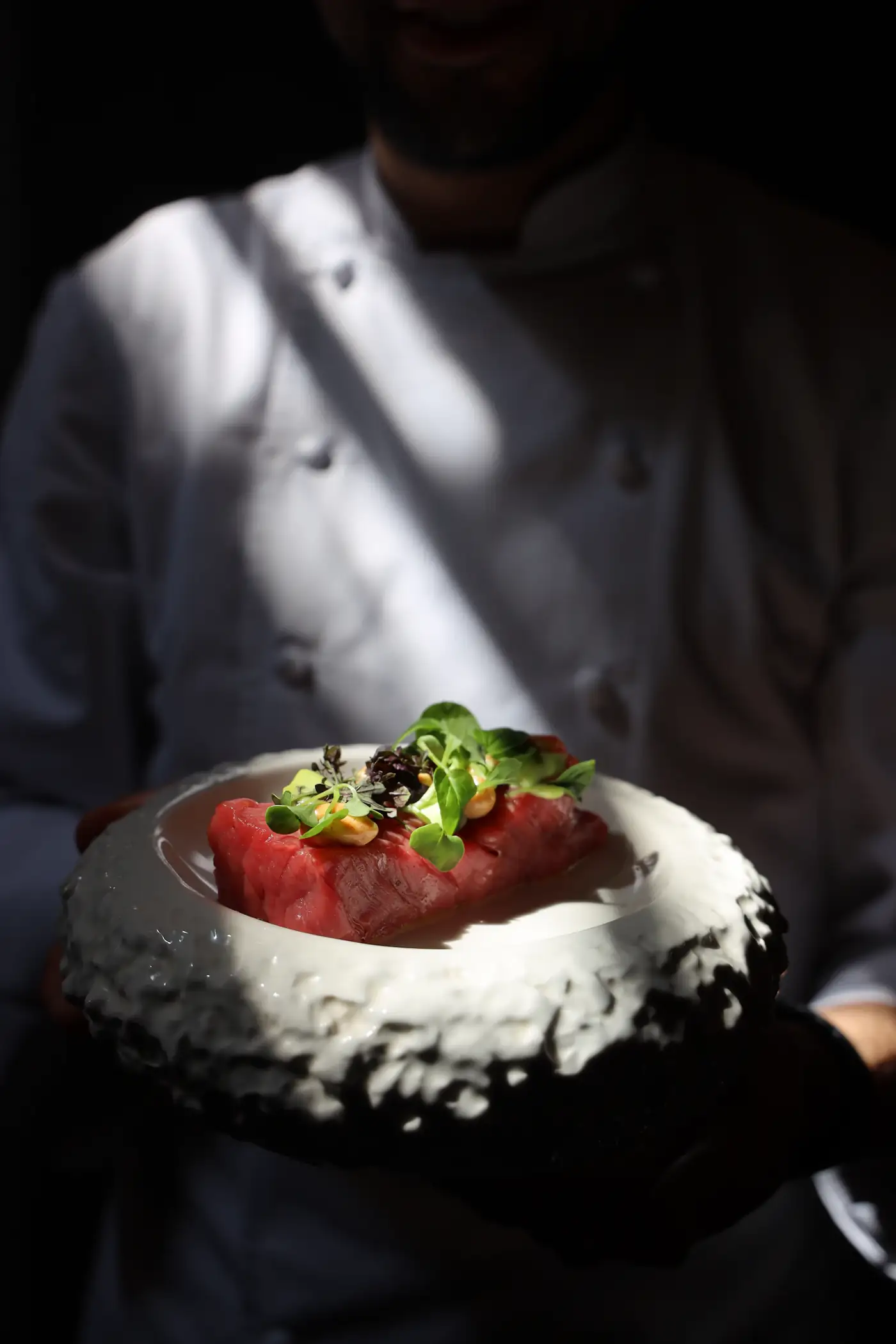 Dish of greens in a textured white bowl